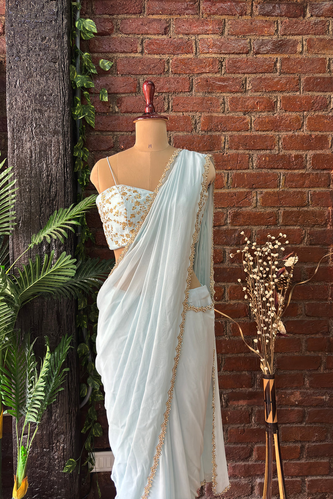 Powder Blue Pre-Draped Saree With Zari Work Bustier