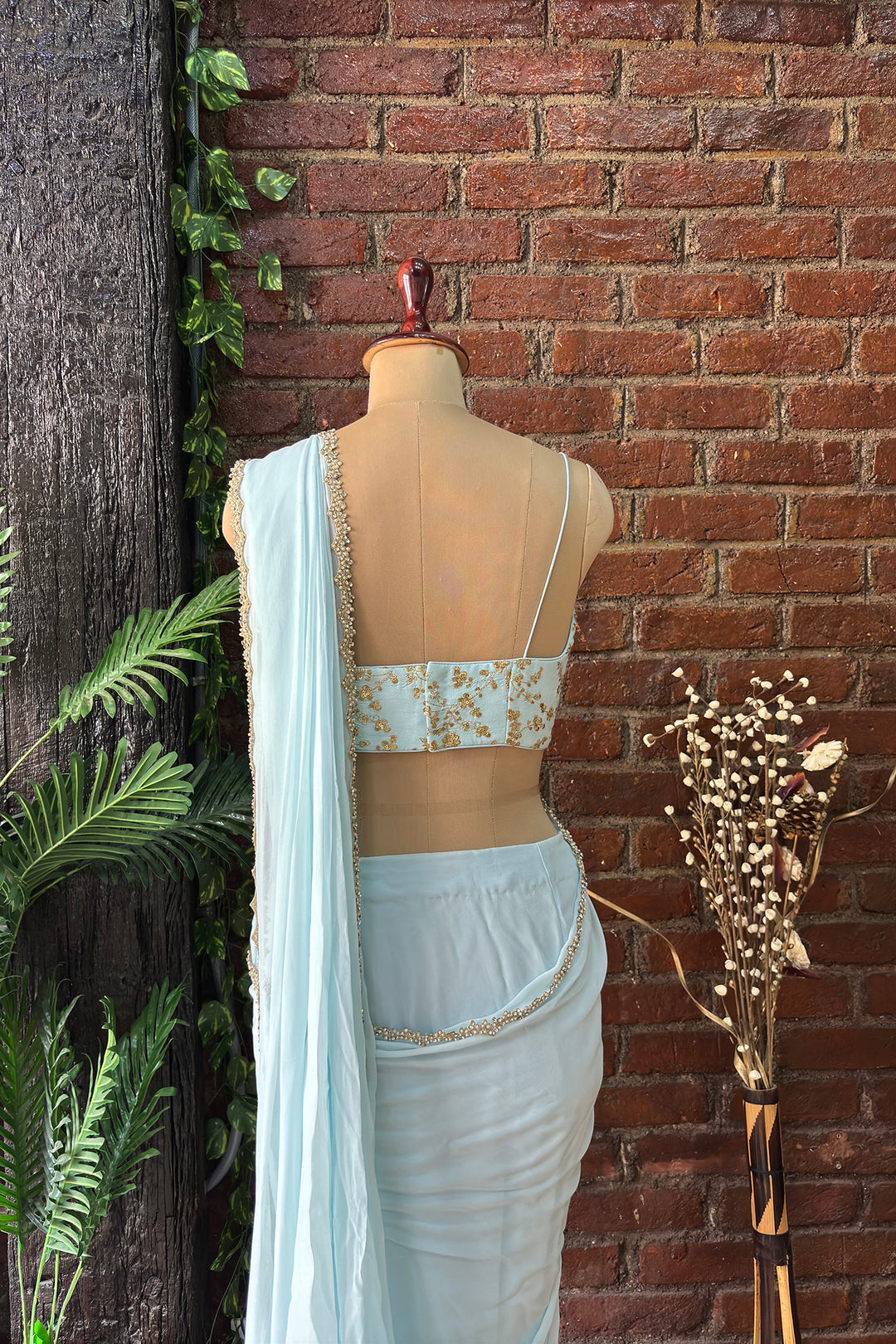 Powder Blue Pre-Draped Saree With Zari Work Bustier