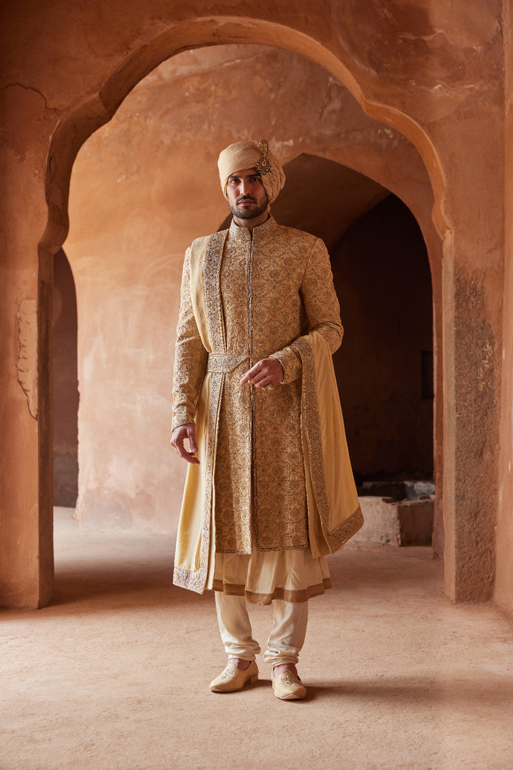 Gold Raw Silk Embroidered Sherwani With A Kalidar Choga And Churidar Pyjama In Beige Monga Tussar