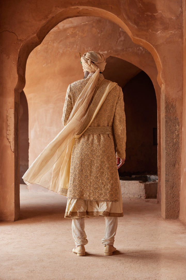 Gold Raw Silk Embroidered Sherwani With A Kalidar Choga And Churidar Pyjama In Beige Monga Tussar