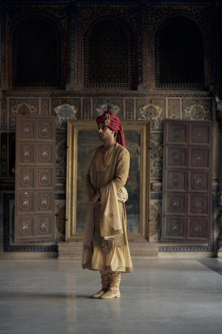 Gold Matka Silk Angrakha Style Sherwani With A Chanderi Booti Choga And Churidar