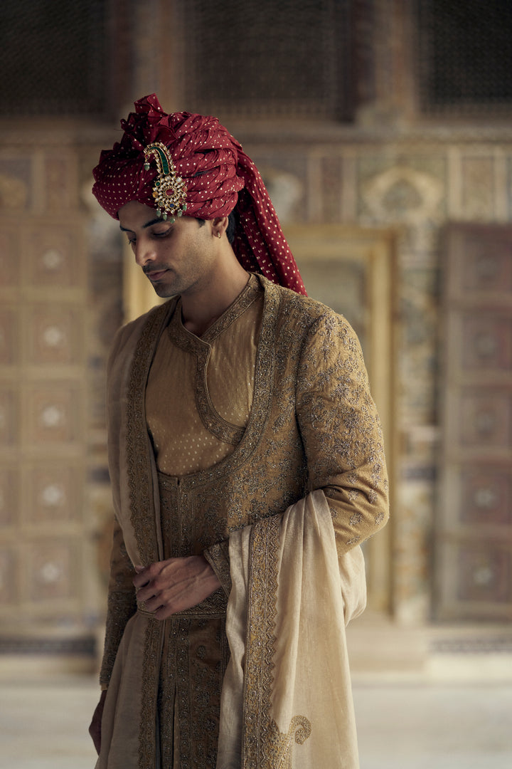 Gold Matka Silk Angrakha Style Sherwani With A Chanderi Booti Choga And Churidar