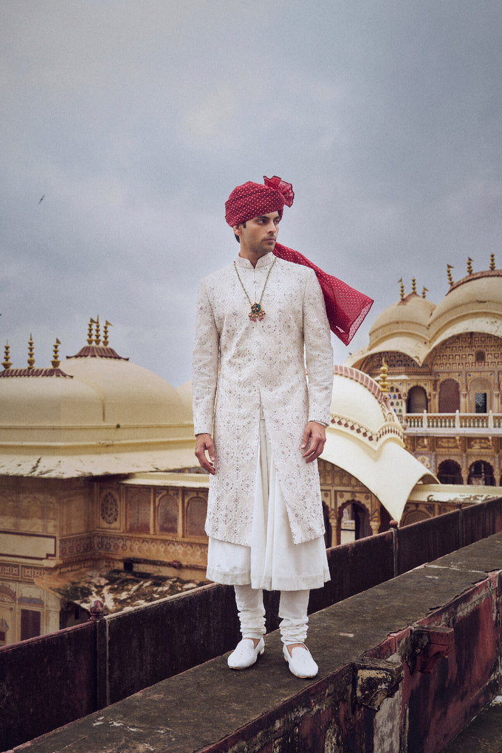 Ivory Raw Silk Sherwani With A Cotton Silk Choga And Churidar