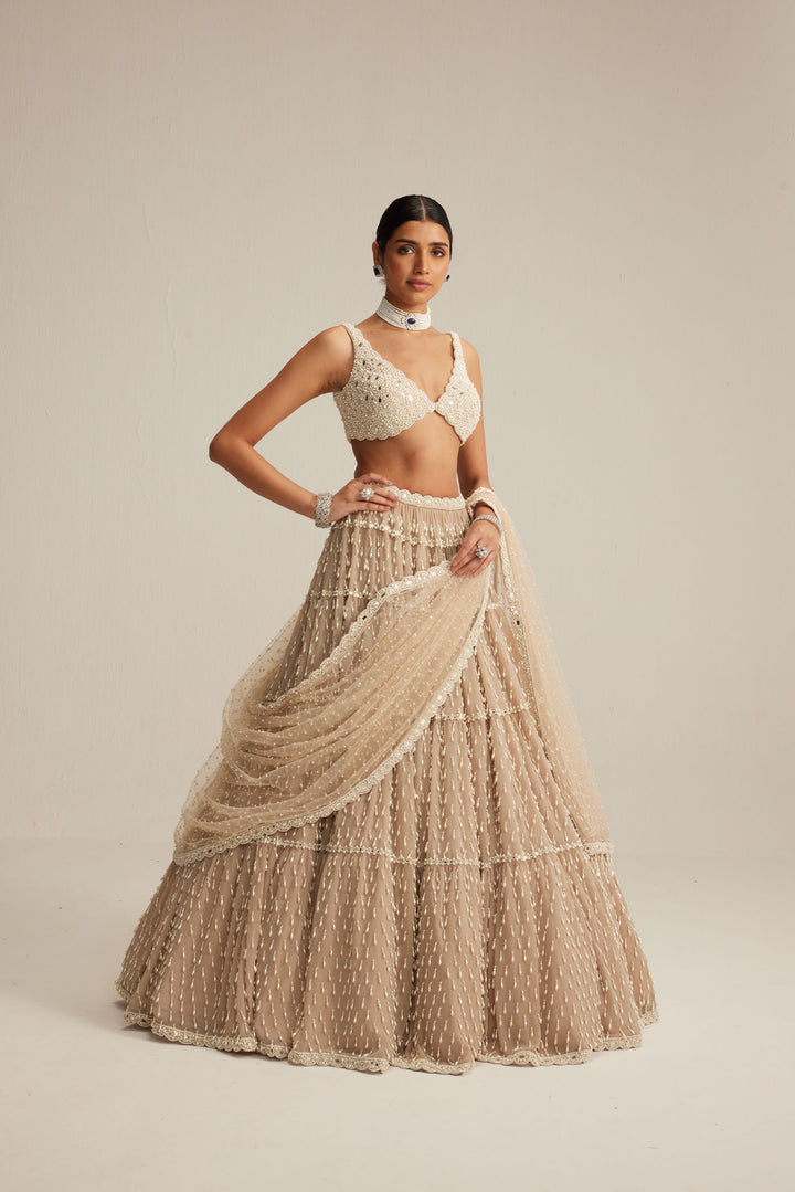 Light Beige Pearl Drop Multi Tier Lehenga Set.