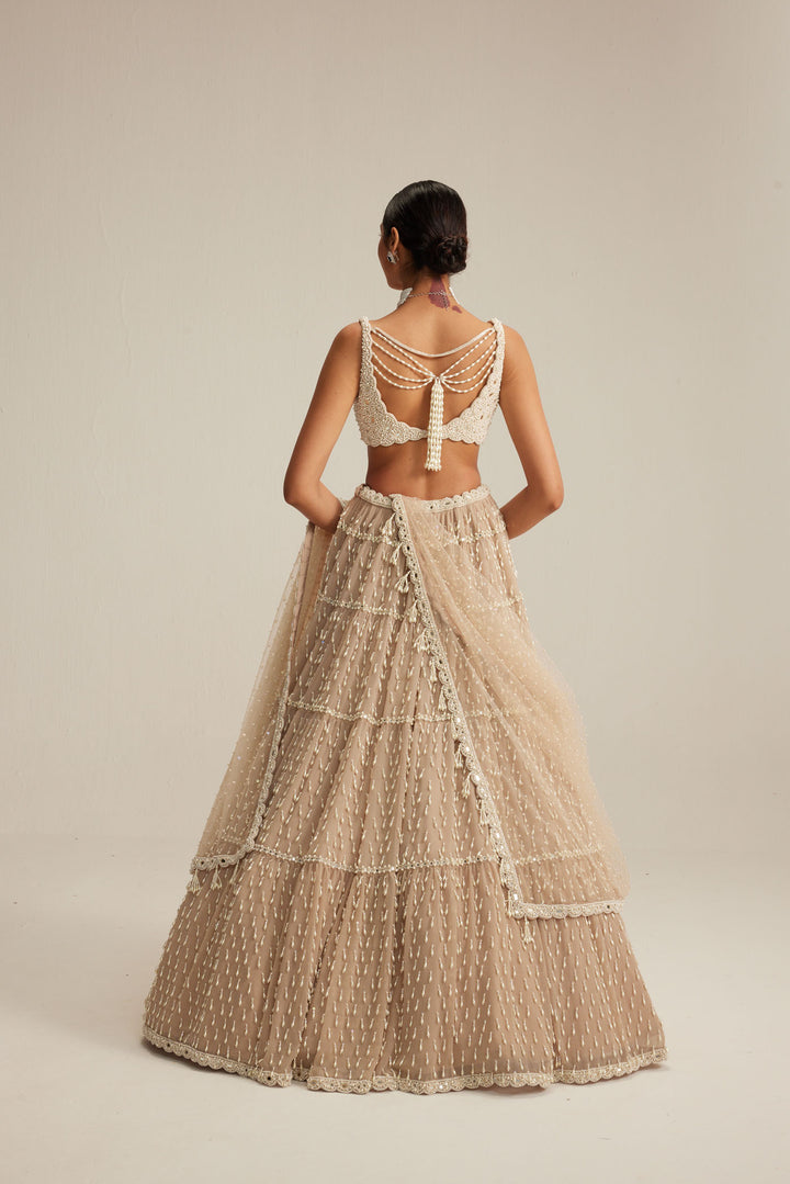 Light Beige Pearl Drop Multi Tier Lehenga Set.