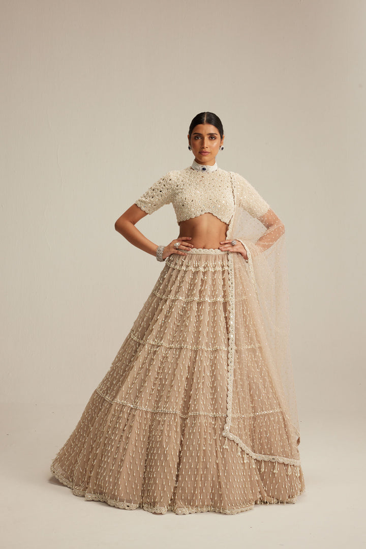 Light Beige Pearl Drop Multi Tier Lehenga With High Neck Blouse Set.